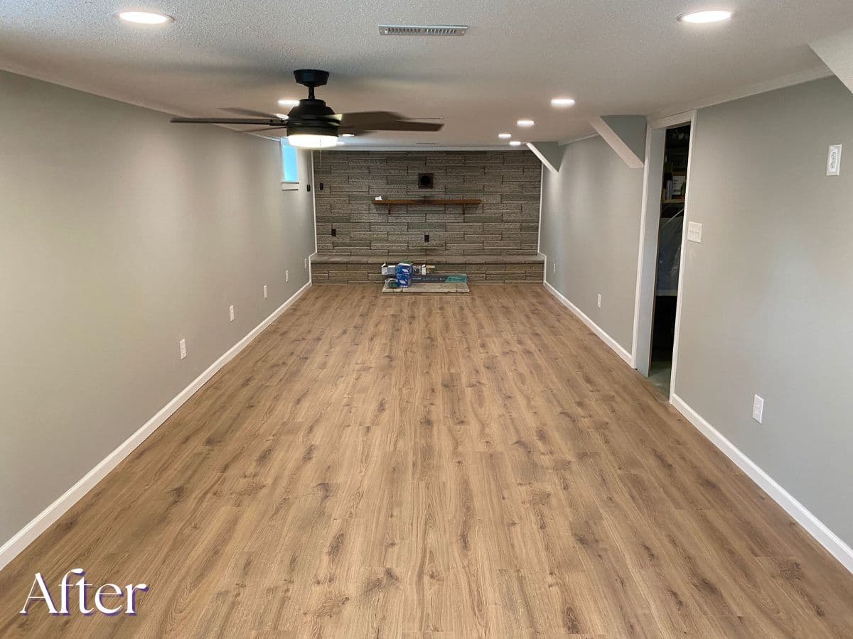 Basement after conversion - finished den by V&C Remodeling